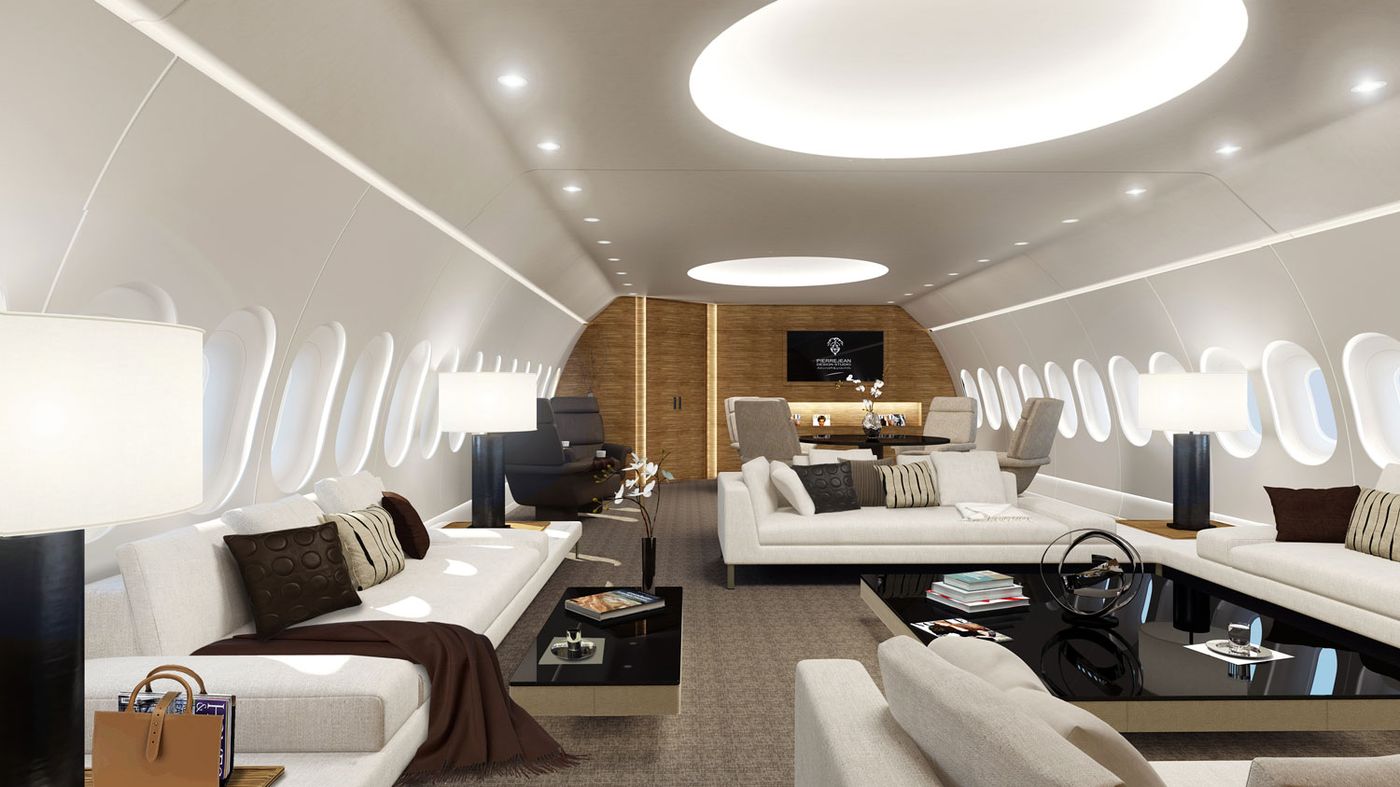 Wide lounge cabin with sofas on a VIP airliner
